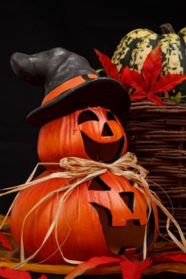 two pumpkins with witch hat
