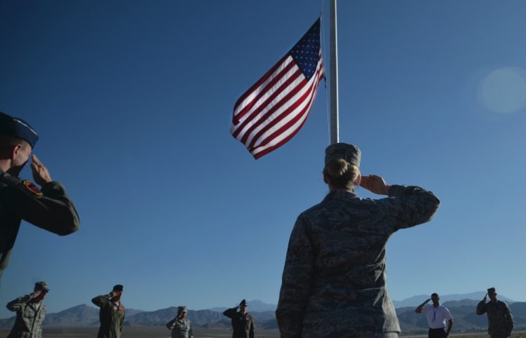 soldier saluting the flag