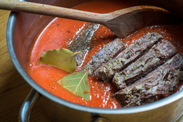 beef brisket in tomato broth soup in pot