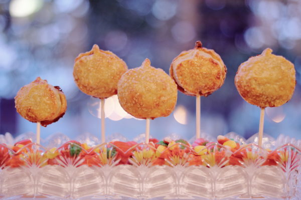 Mini pumpkin pie lollipops in a candy dish