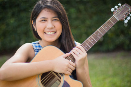 young girl with a guitar