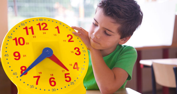 Little boy learning the clock