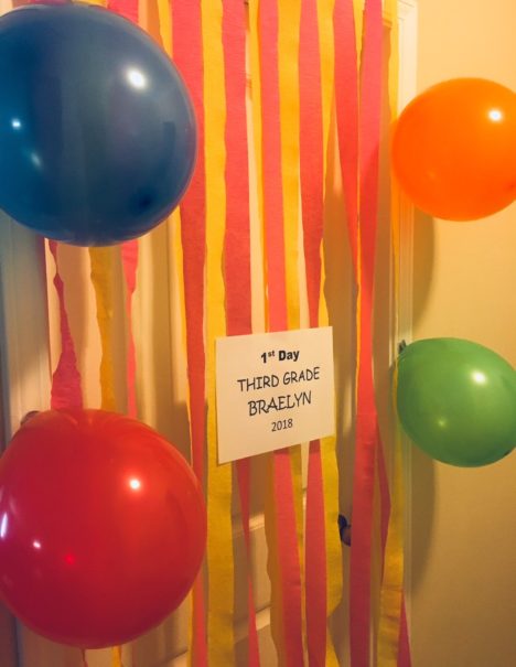 balloons and streamers hanging from doorway