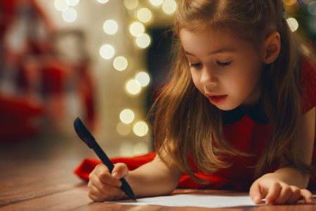 little girl writing thank you note
