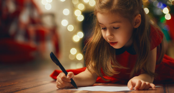 little girl writing thank you note
