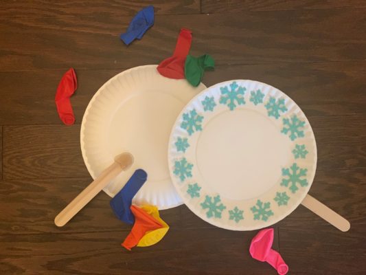 deflated balloons with paper plate rackets