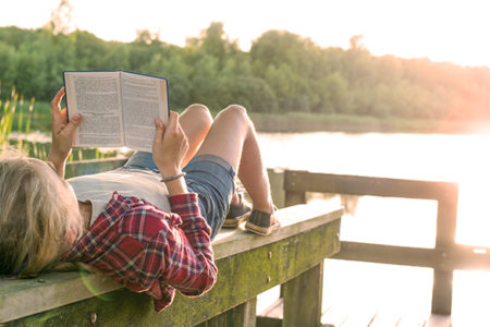 girl reading outside