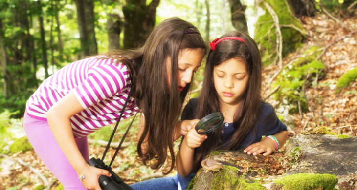 two girls exploring the woods