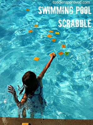 Girl swimming and collecting alphabet sponges