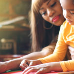 Mother and daughter engaged in a learning activity