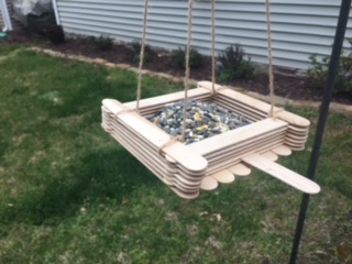 bird feeder made out of popsicle sticks