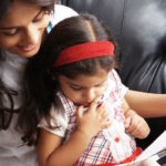 parental involvement: mother reading to child