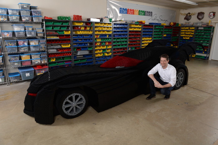 image of Nathan Sawaya with LEGO Batmobile