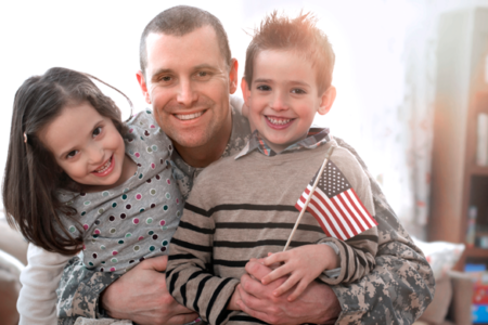 military family hugging