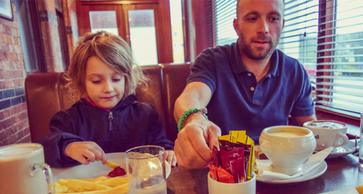 father and daughter eating together