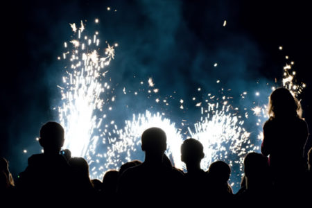 people watching a fireworks display