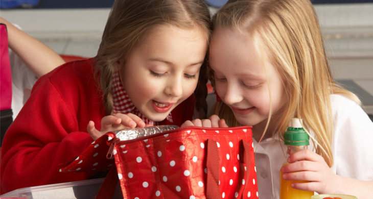 kids looking in lunch box