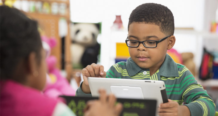 little boy using tablet