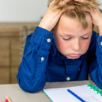 child frustrated by homework