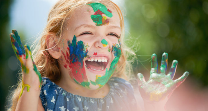 happy girl with paint on her face