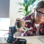 girl doing robotics workshop