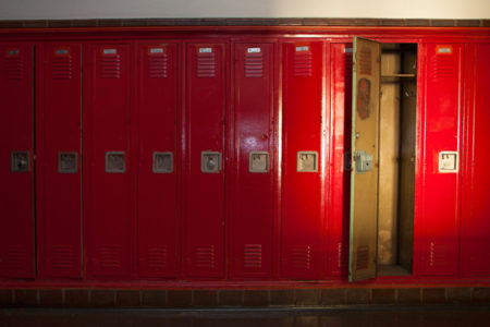 one empty locker among row of closed lockers