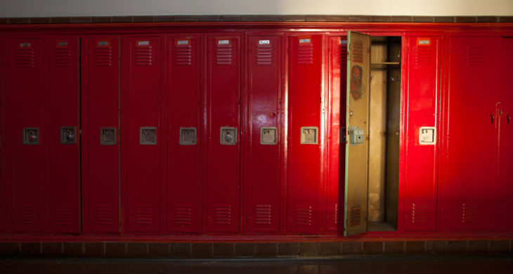 one empty locker among row of closed lockers