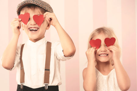 kids with paper hearts over their eyes