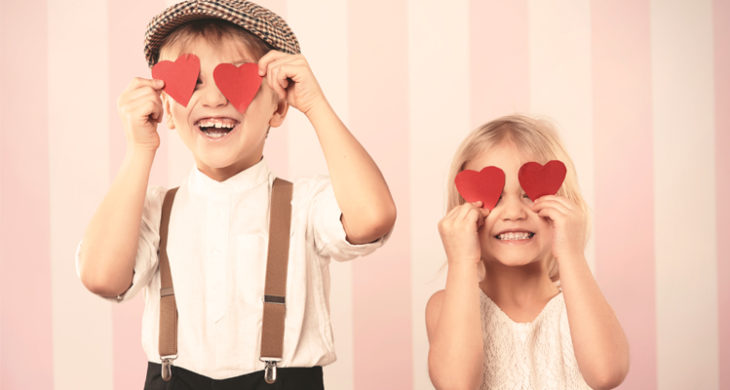 kids with paper hearts over their eyes