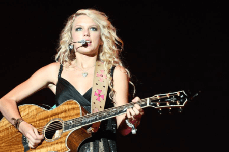 American country musician Taylor Swift performing live.