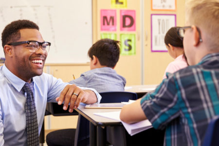 teacher and student in classroom