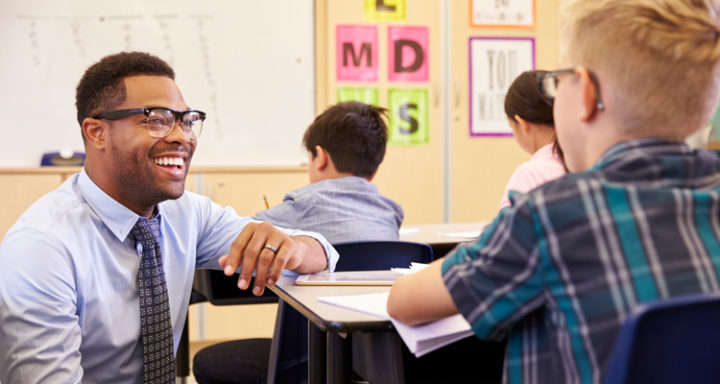 teacher and student in classroom