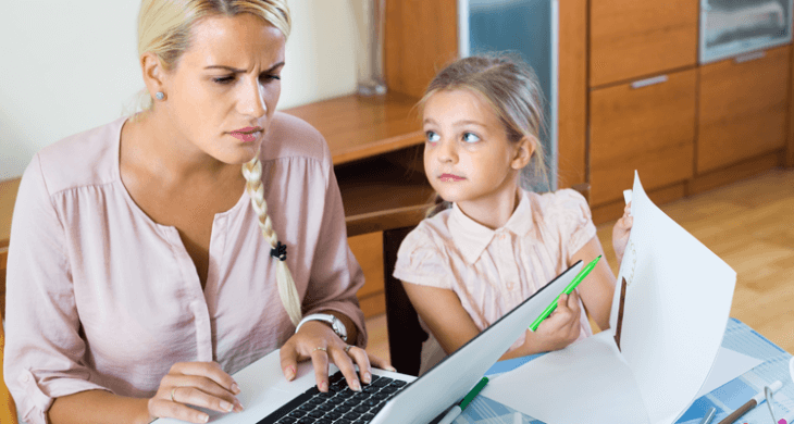 mom using computer ignoring her daughter drawing