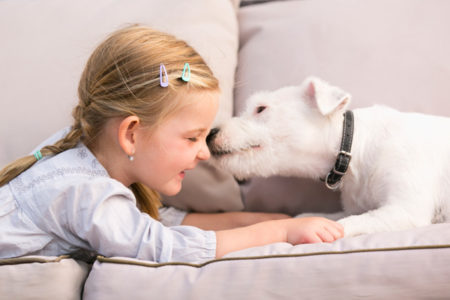 child looking at dog receives many life lessons