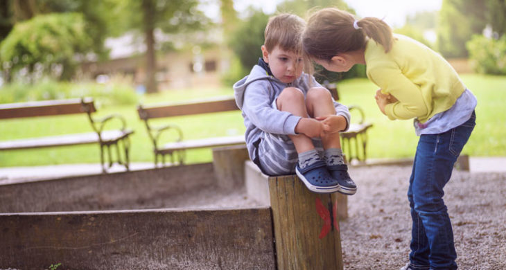 Girl Supporting Sad Boy Sitting Alone