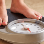child's feet on scale