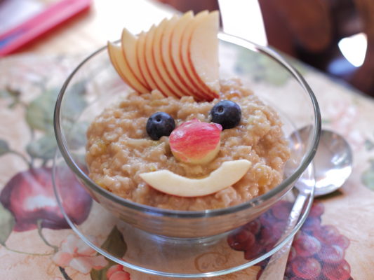 oatmeal with fruit in smiley face shape