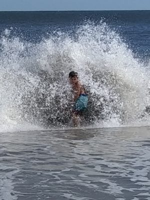boy in a breaking wave
