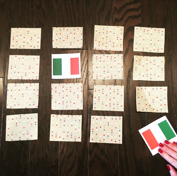 cards on a table with flag illustration on inside