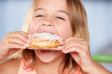 girl eating donut