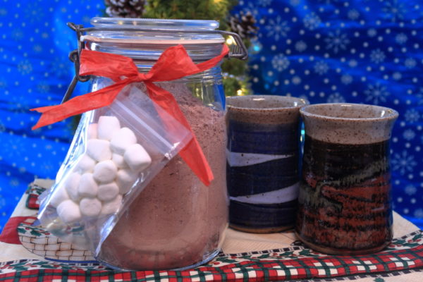Jar of Cocoa Mix with Marshmallows and Mugs