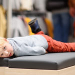 kid bored while parents shops