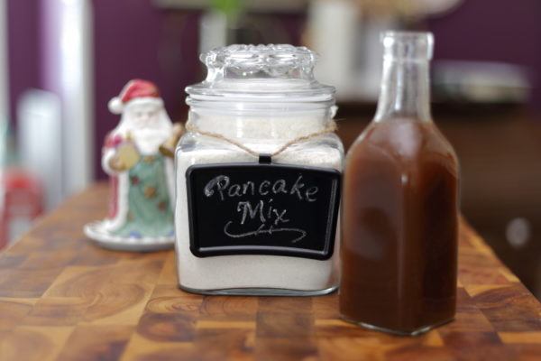 Jar of pancake mix and bottle of syrup