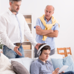 kid ignoring dad, listening to music