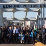 The Obamas and the Bushes continue across the bridge.