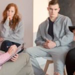 School aid talking to group of teenager
