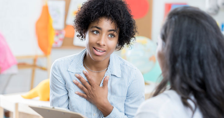 Concerned mom talks with her child's teacher