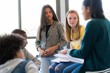 students discussing in classroom