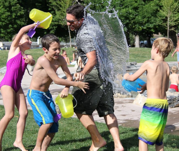 kids splashing water in summer