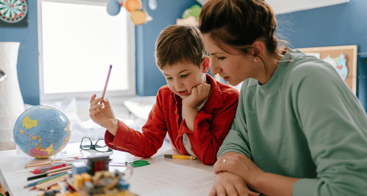 mother and son do homework together